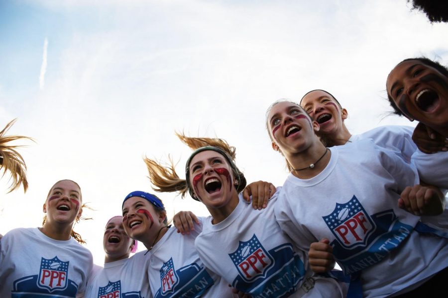 The senior/sophomore powderpuff team huddles before the game chanting to get themselves ready.