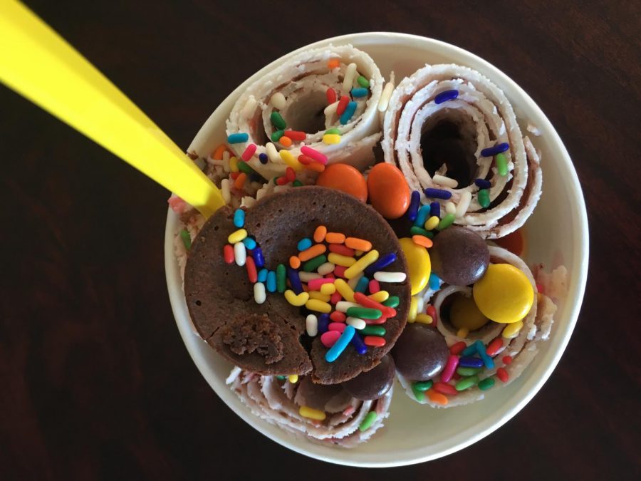 A bowl of ice cream from Pandora Rolled Ice cream can be bought with a variety of toppings such as candy, sprinkles and brownies after the ice cream has been rolled into its classic shape.