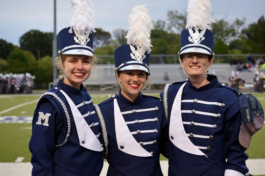 Big Blue Marching band Drum Majors (left to right) Tess Garvin, senior; Maggie Fontanini, junior; and Chris Carter, senior, in uniform at Bishop Stadium. 