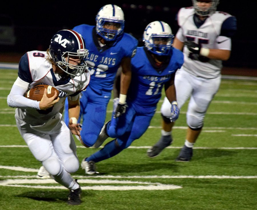 Sophomore Ashton Brennan runs the ball down the field during the Manhattan High School Varsity football game. The rival game against Junction City took place on Oct. 5 at JC. The Manhattan Indians played hard, but their efforts werent enough and they lost their first game of the season 9-7. 