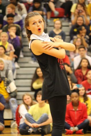 Freshman Anika Nyp poses during her dance routine. Nyp and six other dancers performed their dance during the homecoming pep rally. The dancers had to learn this and their routine for October sixth band festival. Photo by Makenna Wollenberg