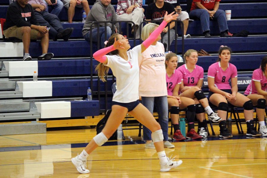 Senior Haleigh Harper serves the ball during the Manhatan High School senior night. Senior night was Oct. 9, where the Lady Indians played against their league rivals Emporia.  