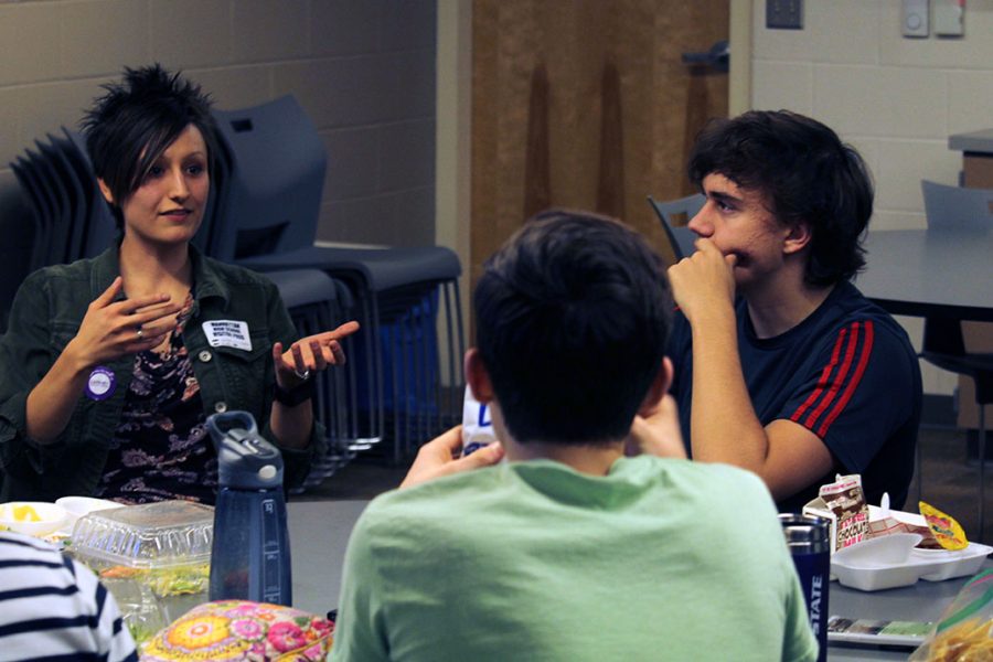 Sunset Zoo Science Communications Fellow Lisa Vangsness talks about her profession and research as junior Alex Andresen listens. Students had the opportunity at lunch to come together and listen to Vangsness through the Teen Science Cafe series. 