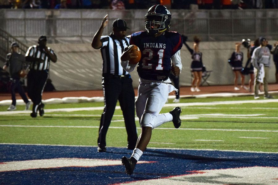 Senior Kevontae McDonald runs in a touchdown for the Manhattan High School Varsity football team. McDonald is a varsity athlete at MHS, at the Oct. 26 he impacted the team and helped them take down the Wichita Southeast team, 73-20.