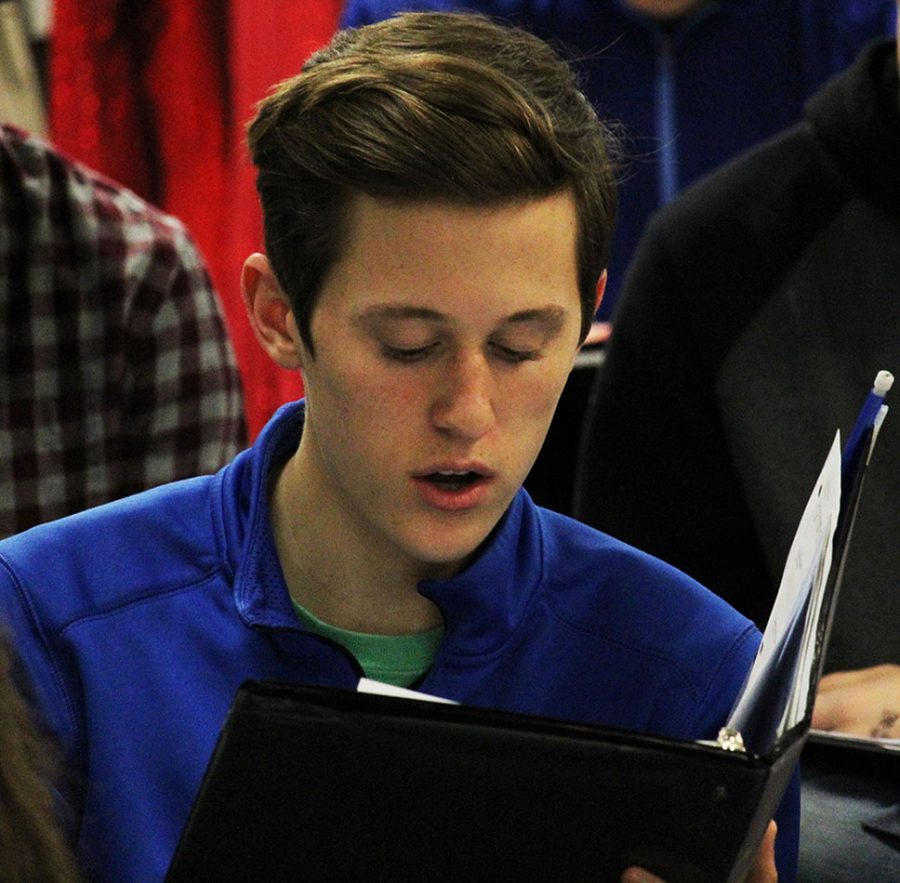 Junior Tysen Plummer pratices with the sixth hour choir. Plummer also participates in the musical in the chores. 