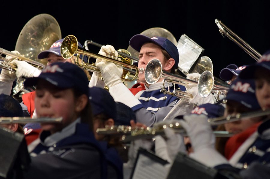 Junior Ethan Myer performs songs from the Manhattan High Big Blue Marching Band’s set “Bluehemian Rhapsody” during the band concert on Nov. 29. 