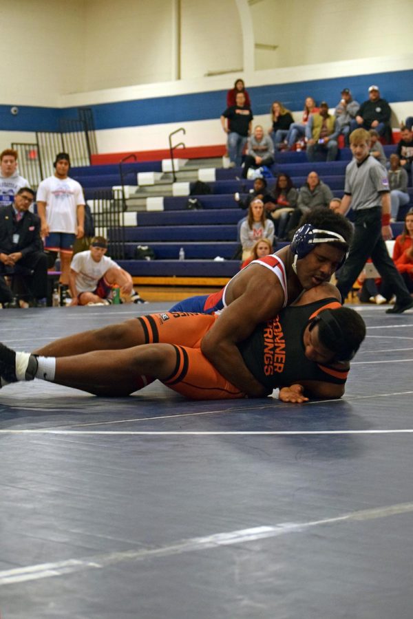 Senior Robert Houston takes down his opponet during the senior night wrestling tournament on Thursday. 