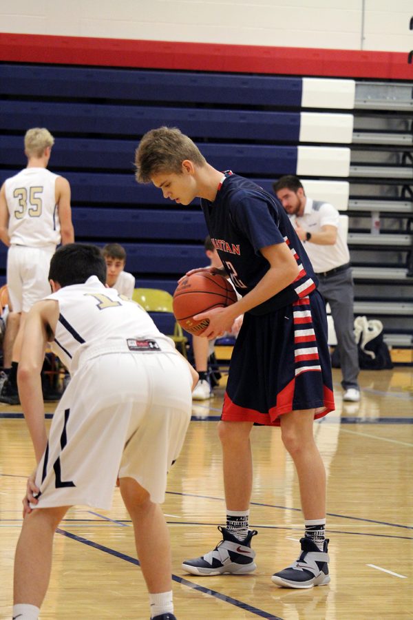 Freshman Coy Cavender focuses before shooting at the free throw line during the Freshmen Boys Basketball Quad Tournament. 