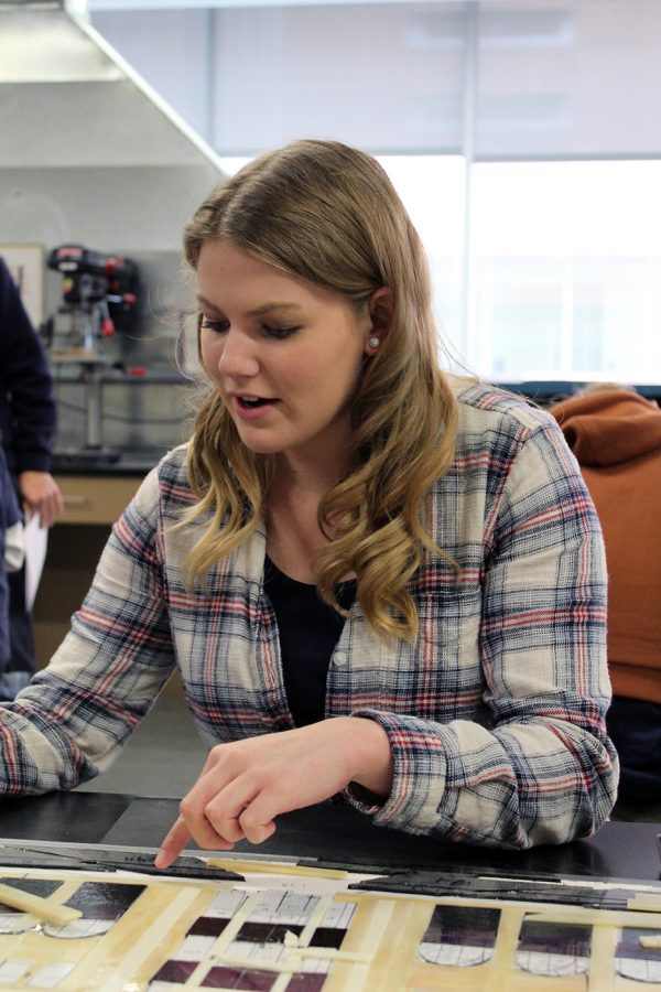 Senior Mikayla Larkin works on a stain glas piece that she plans to give to her parents as a graduation gift. 