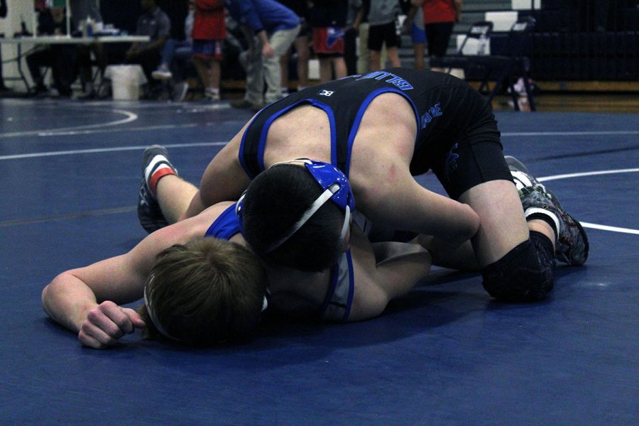 Senior J.V. wrestler Masson Garren takes on a member the Junction City wrestling team on January 25, 2019.