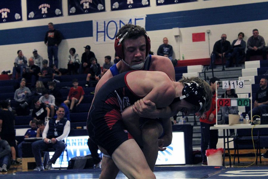 Junior Adrian Kaus wrestles against his opponet from Wamego at the home JV wrestling meet on Jan. 25. 