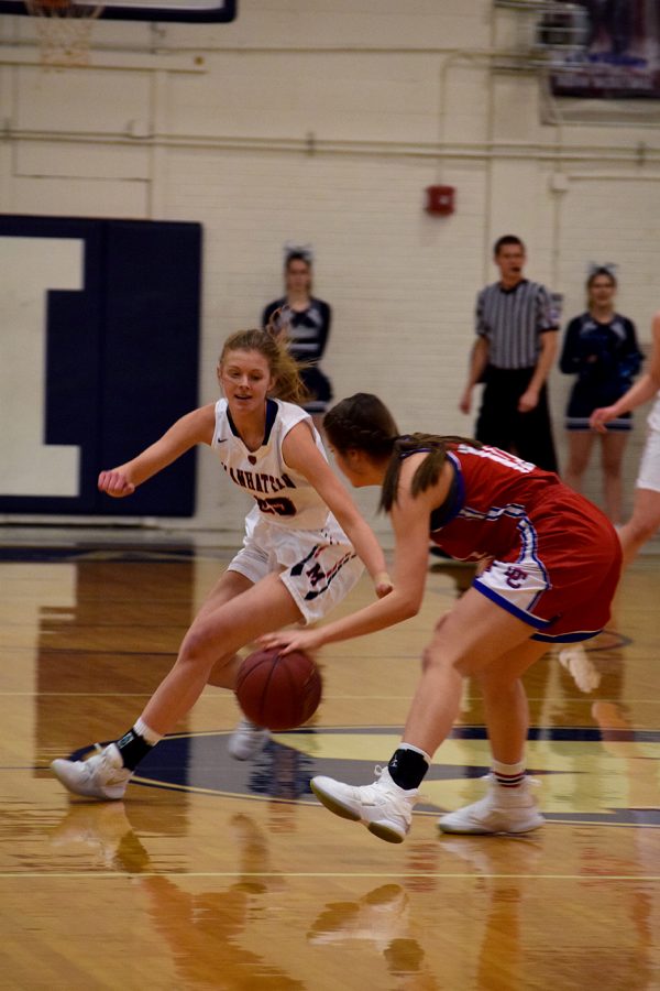 Senior Taylor Johnson works to guard her opponet during the Sub-State girls basketball game. The game was the final home game for the Lady Indians, the night was sucessfull, the Lady Indains won 54-36. 