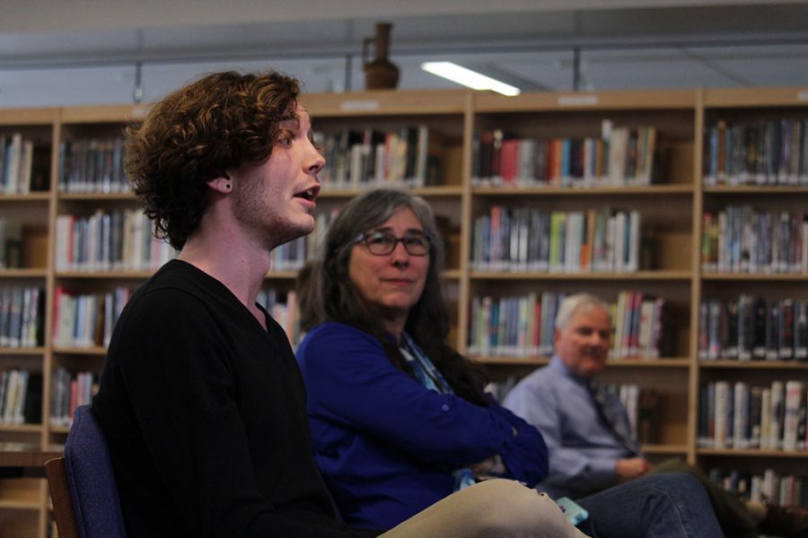 Senior Jacob Wineland addresses new principal candidate Martin Straub with a question while teacher Leslie Campbell listens. Wineland attended the meet-and-greet on Friday after school with questions pertaining to student equality and minority groups.