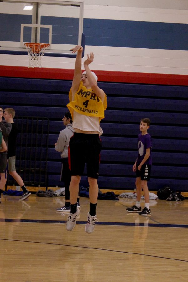 Senior Mason Jackson shoots the ball during his team's warm-up time at the intramural basketballl games on Feb. 5. Jackson's team the L.A. Leakers first game of the night was against the Star-Spangled Ballers.