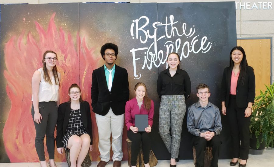 Manhattan High Forensics team poses in front of the theater at the Olathe North West tournament. The team went home with two bids for the National Tournament in April and semifinalist rankings.