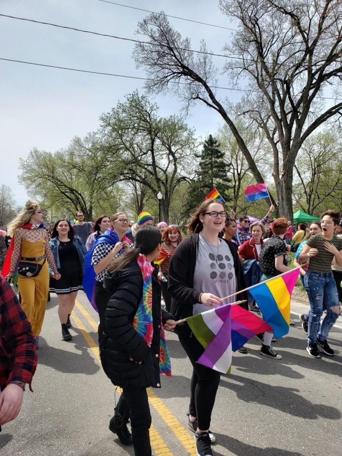 MHS students and other attendees walk together down on Poyntz Ave. on April 18.
