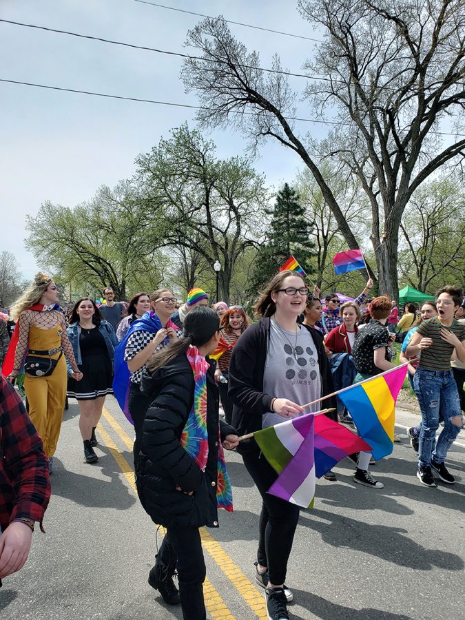 MHS students and other attendees at MHK Pride walk together down Poyntz Ave on April 13. 