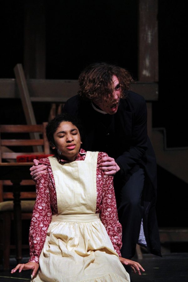 Senior+Jacob+Wineland%2C+playing+Reverend+Hale%2C+grips+the+shoulders+of+junior+Trinity+Martinez%2C+playing+Tituba%2C+during+a+scene+in+which+Wineland+is+urging+Martinez+to+confess+to+the+sin+of+witchcraft+in+%22The+Crucible%22+during+their+final+dress+rehearsal+on+April+16.+The+show+ran+April+17+through+19+in+Rezac+Auditorium.