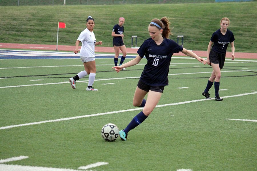 Junior Ainslie Markle keeps possession of the ball during the Lady Indians j.v. soccer teams game against Emporia on April 9. 