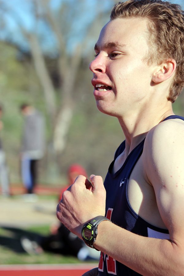 Sophomore Daniel Harkin runs around the track during an event. 