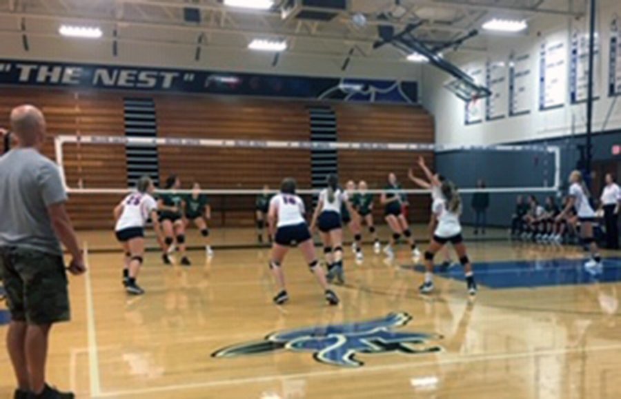 The J.V. volleyball teams plays their set in the J.C. Invitational.
