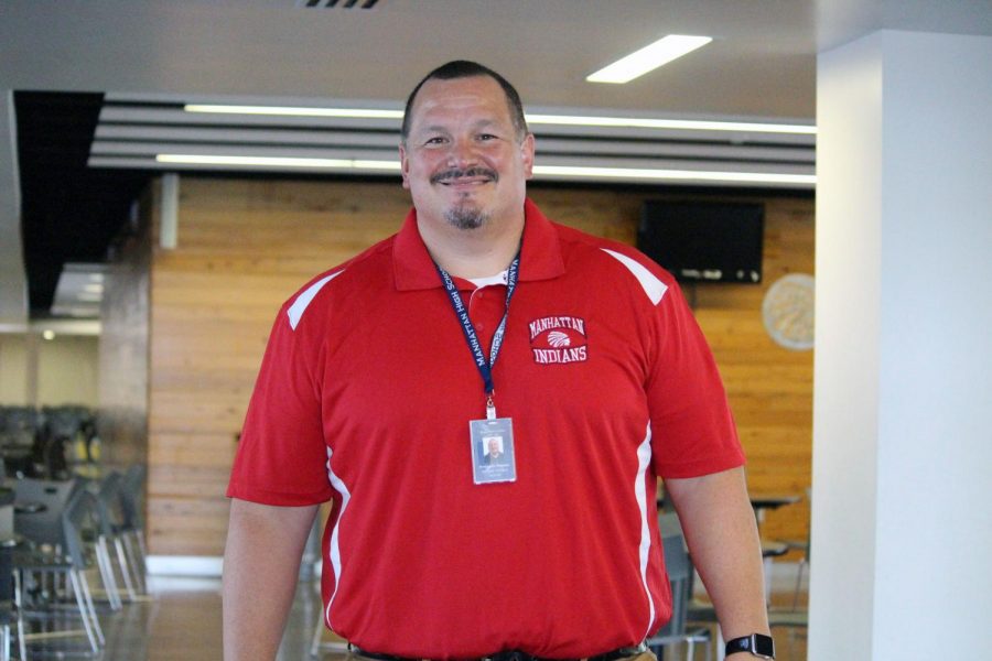 Junior class principle Benjamin Jimenez -- a new addition to the Manhattan High administrative team -- stands in front of the Prentup Commons, his usual hangout during lunch and passing periods. 