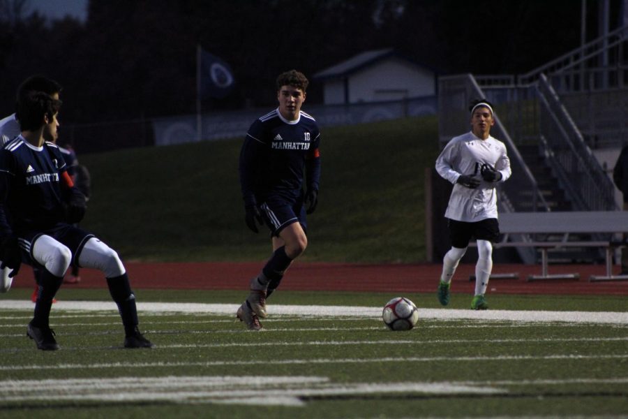 Senior Hunter French dribbles the ball down the field at the teams last home game against Hayesville Campus.