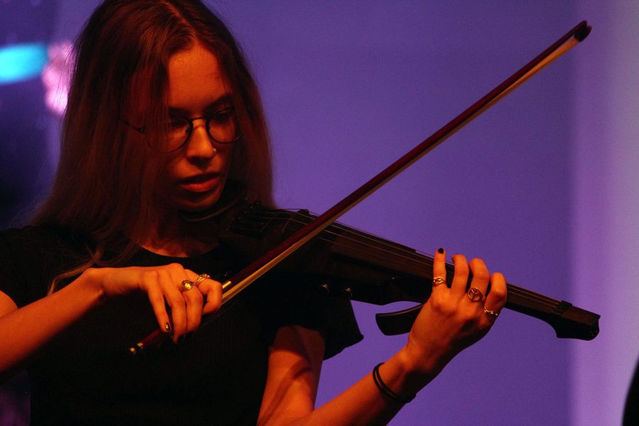 Senior Grace Hart focuses on playing her viola solo for the attentive crowd.  The orchestravaganza  took place last Thursday and Friday in Rezac Audiroium