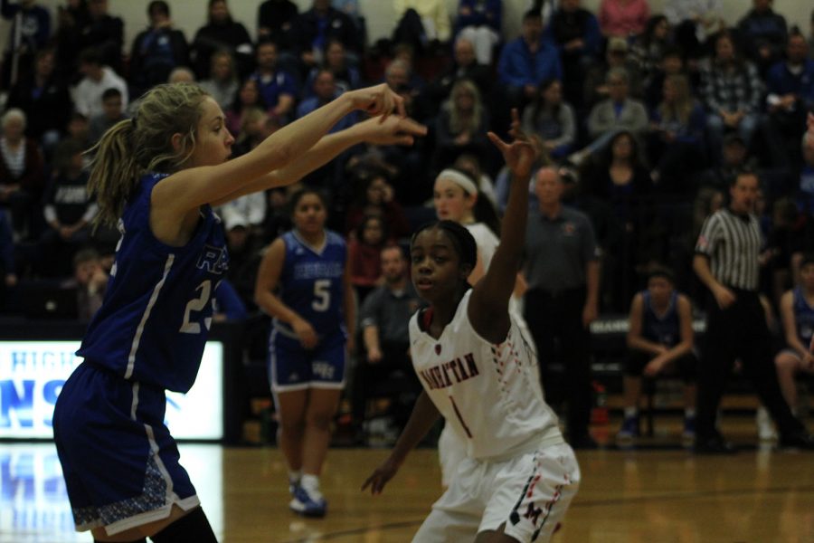 Freshman Destiny Yates defends a Washburn Rural guard. The game occured on Jan. 7 at MHS. The final score was 53-41 in which the Varsity Girls faced their second loss of the season.