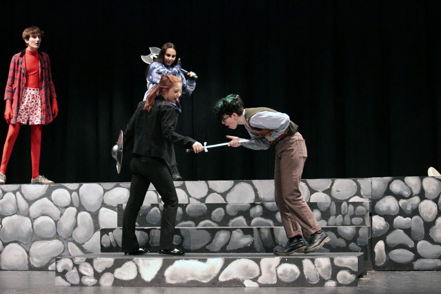 Senior Ivy Auletti stabs junior Max Barbe during their scene in She Kills Monsters. 