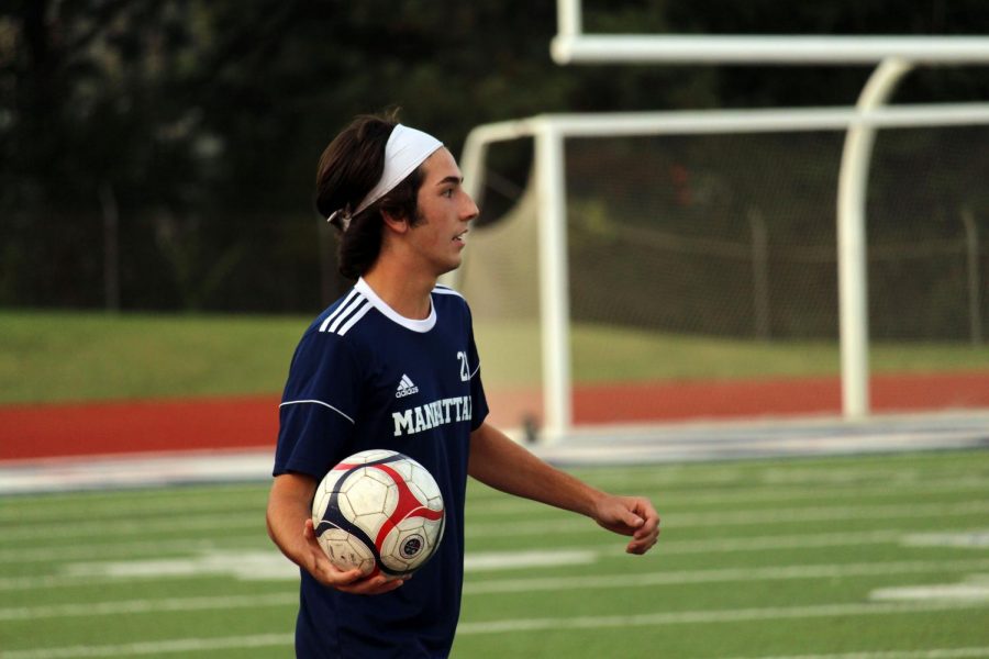 Senior Easton Roberts looks for an open man for a thrown in during the Seaman home game on Sept 22. The teams tied 1-1. Photo by Kris Long.