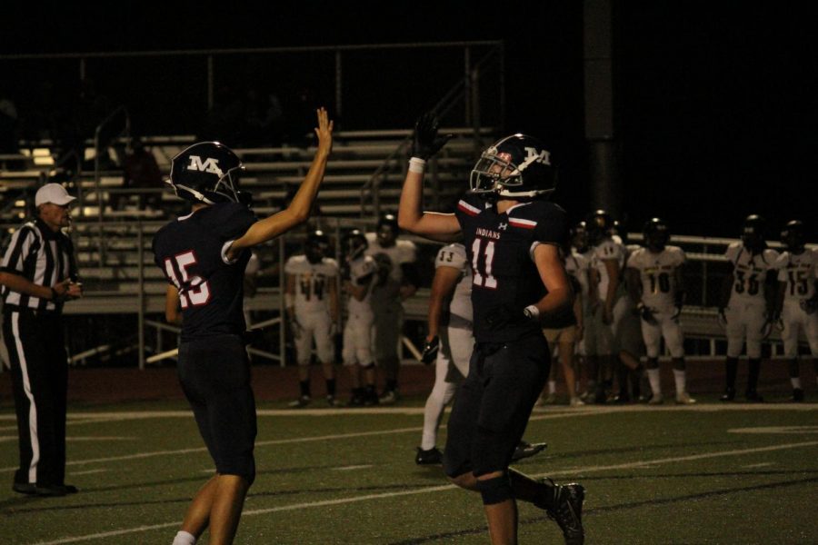 Juniors Grant Snowden and Trey Holloway high five each other after another Tribe touchdown. MHS put up seven on the night in a dominating 42-6 win.