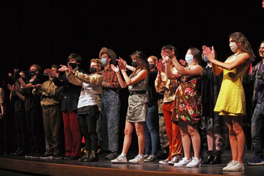 Everyone who was involved in the acting and directing of "Night of Scenes" applauds the audience, along with the technical producers of the show. Prior to the applause, one of the acts called "Boogie Down" ended with choreography that welcomed all of the other performers back onto the stage for a '70s freestyle dance.