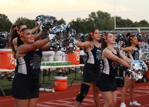 The dance team cheers on the Manhattan High football team in their game against Highland Park on Sept. 7. Photo by Antonio Combs