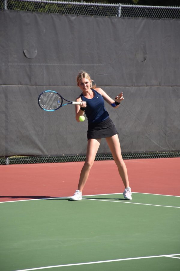 Junior+Jillian+Harkin+sends+the+ball+across+the+tennis+court+at+State.+Harkin+won+the+6A+State+Championship+on+Saturday.+Photo+courtesy+of+Gerald+Wiens