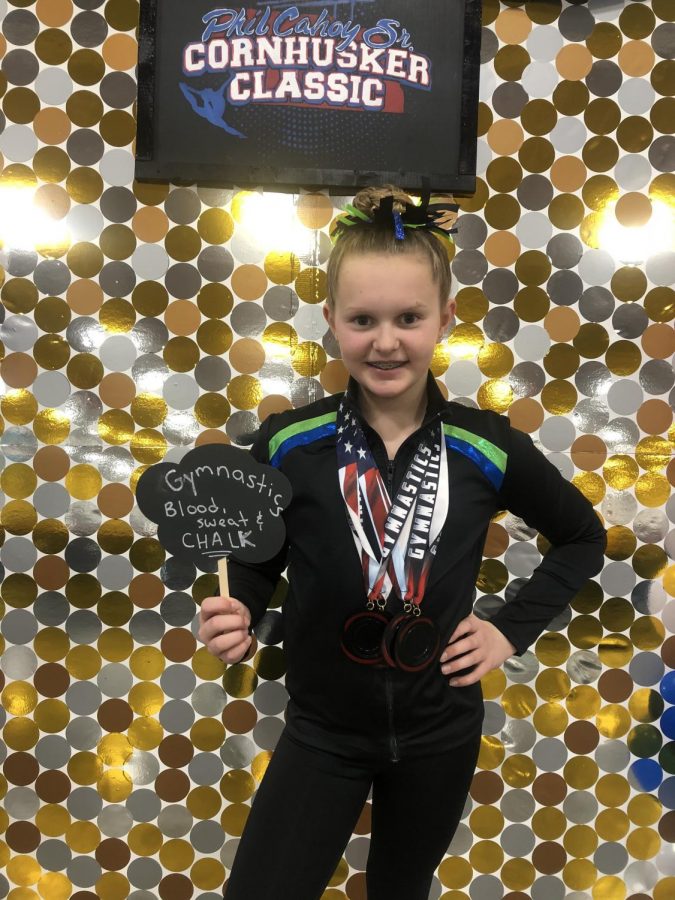 Freshman Emma Crouch, then 12 years old, poses with her winnings at the Phil Cahoy Sr. Cornhusker Classic. Photo courtesy of Jamie Crouch