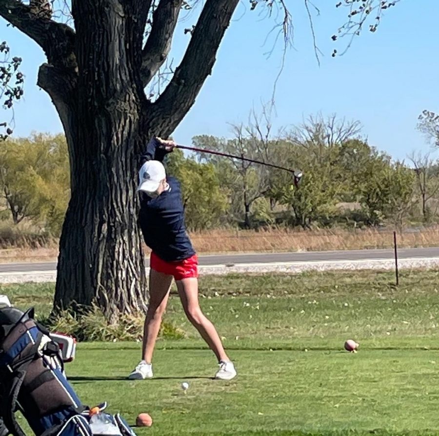 Sophomore Rylee Wisdom gears up to send the ball down the fairway. Wisdom was the only Manhattan High Varsity golfer to advance to day two of State, placing 34th individually. The team placed 10th overall. Photo courtesy of @ManhattanHighGolf Instagram