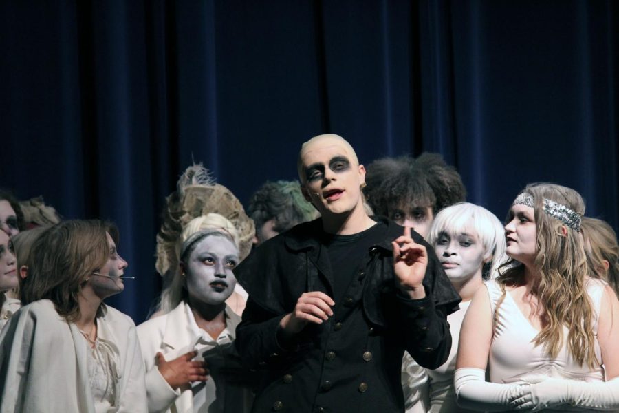 Senior Sam DeLong portrays Fester in The Addams Family production.