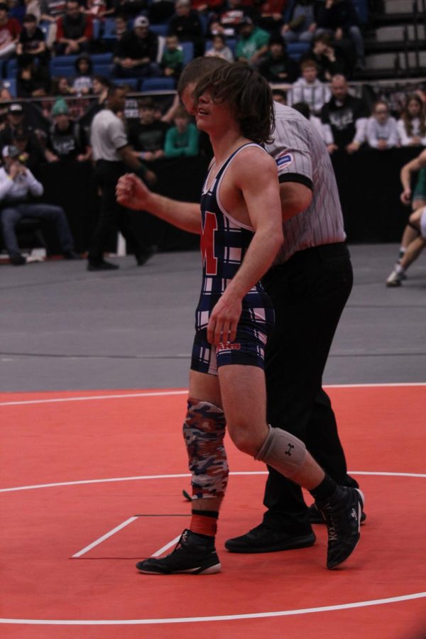 Senior Easton Taylor celebrates his third place victory during the State tournament on Feb. 26.
