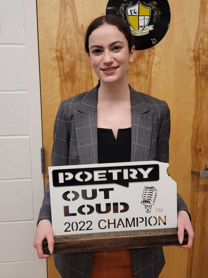 Junior+Allie+Cloyd+proudly+presents+her+Poetry+Out+Loud+Champion+plaque.