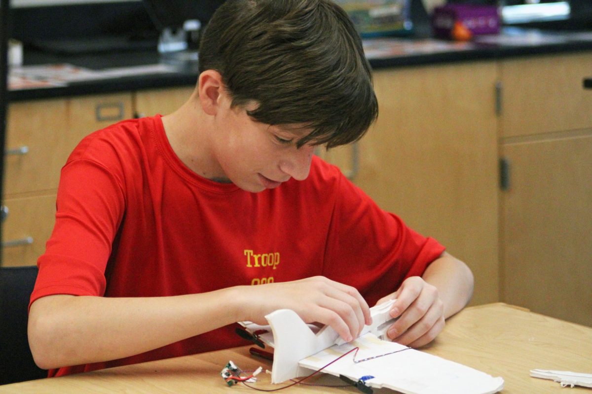 Ready for Takeoff. On Oct. 2, 2025, the MASA club gathered for an exciting evening meeting where students delved into the world of rocket and plane creation. Sophomore Dexter Schmidt put the finishing touches on his plane, eager to take it outside for an exhilarating flight.