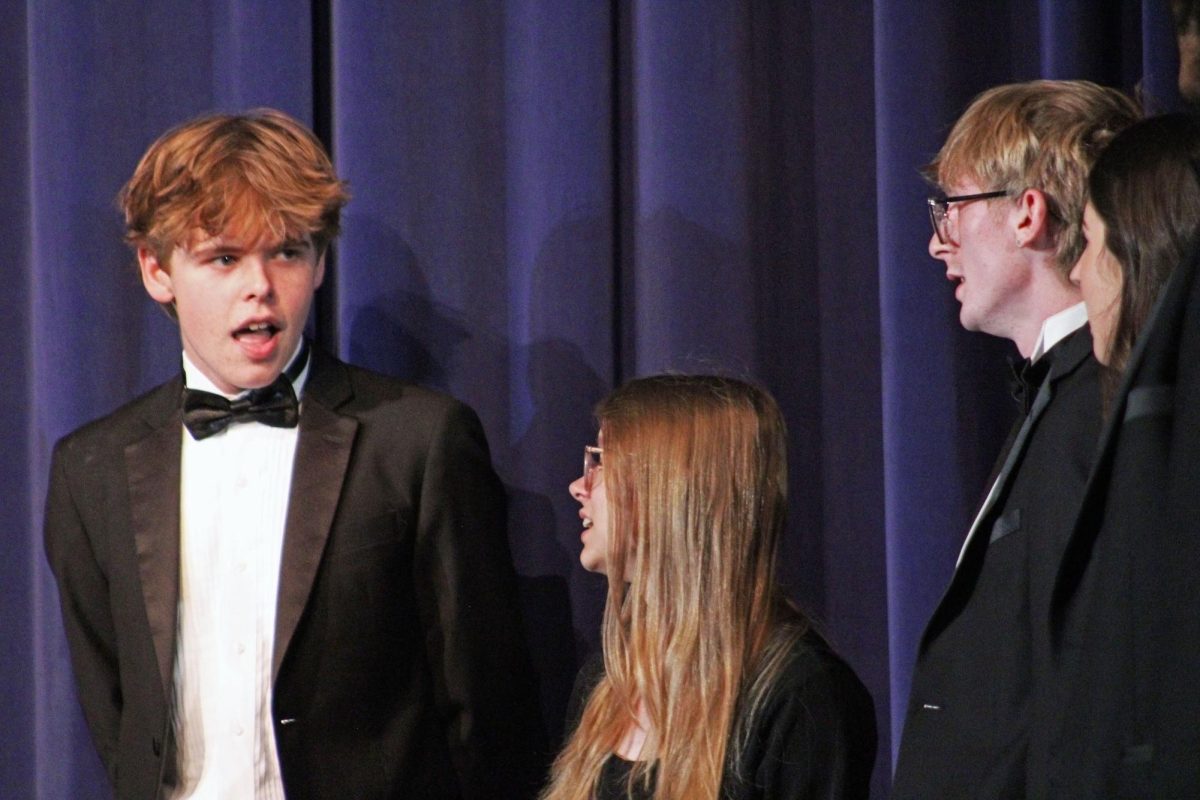 With the excitement in the air and the spotlight shining bright, Manhattan High School's choir hosted their first concert of the year on Oct. 8, 2025, in Rezac Auditorium. Junior Micah Pape and his fellow performers took center stage, enchanting the audience with solo renditions of ABBA classics as the chamber choir prepared to join them behind the curtain.