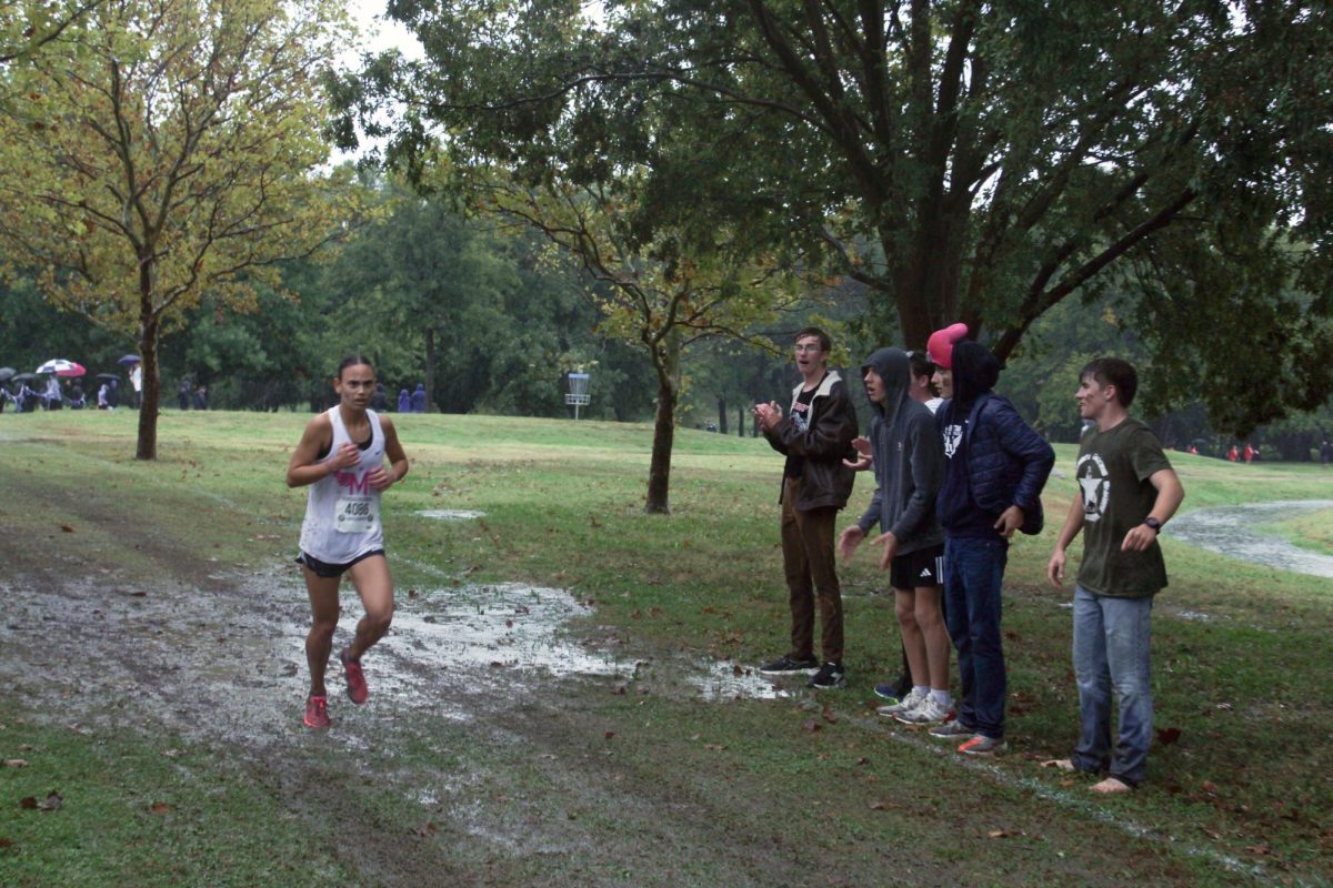 GO Gabie!! Gabrielle Coonverse in the lead while her teammates cheer her on. Gabrielle got first at Regionals to lead Manhattan to get first place. 