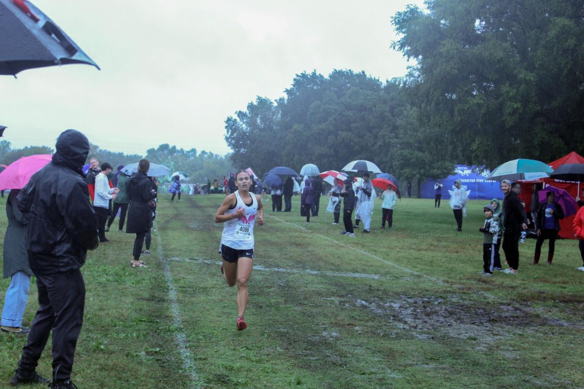 GO Gabie!! Gabrielle Coonverse in the lead while her teammates friends and famaly cheer her on. Gabrielle got first at Regionals to lead Manhattan to get first place and qualify for state. 