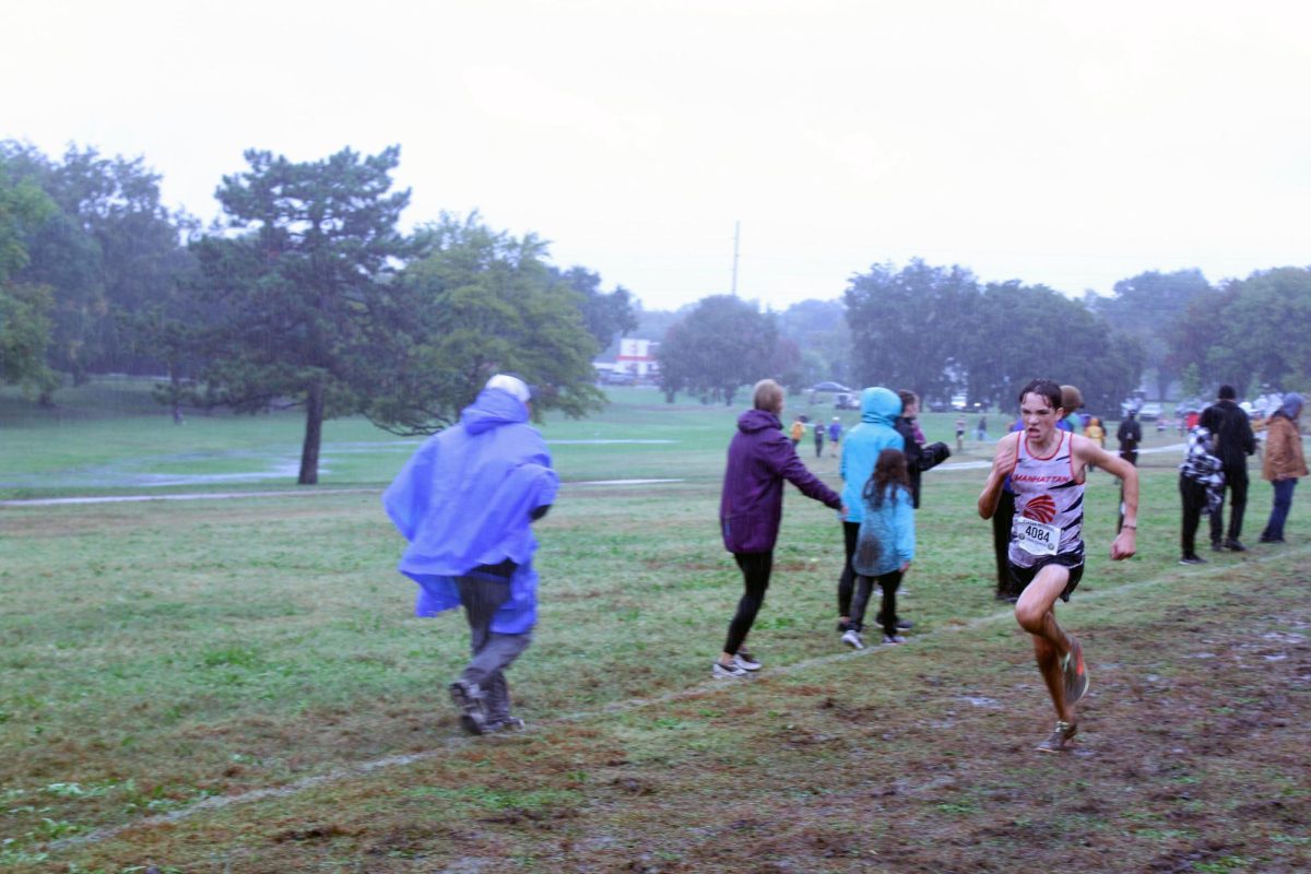 Go Jaxson! Jaxon Wheler sprints toward the finish line being the fastest Manhattan runner. Jaxon leads Manhattan get first place at Regionals. 