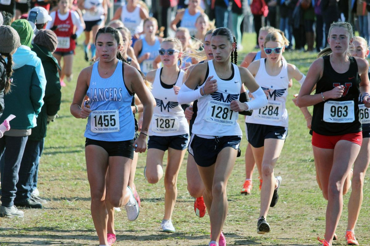 Go Manhattan! Gabrielle Converse in the front of the pack with Isla Spreer and Zara Koehn close behind. Gabrielle, Zara, and Isla placed 3rd, 7th, and 9th leading Manhattan to win State for the first time in 10 years. 