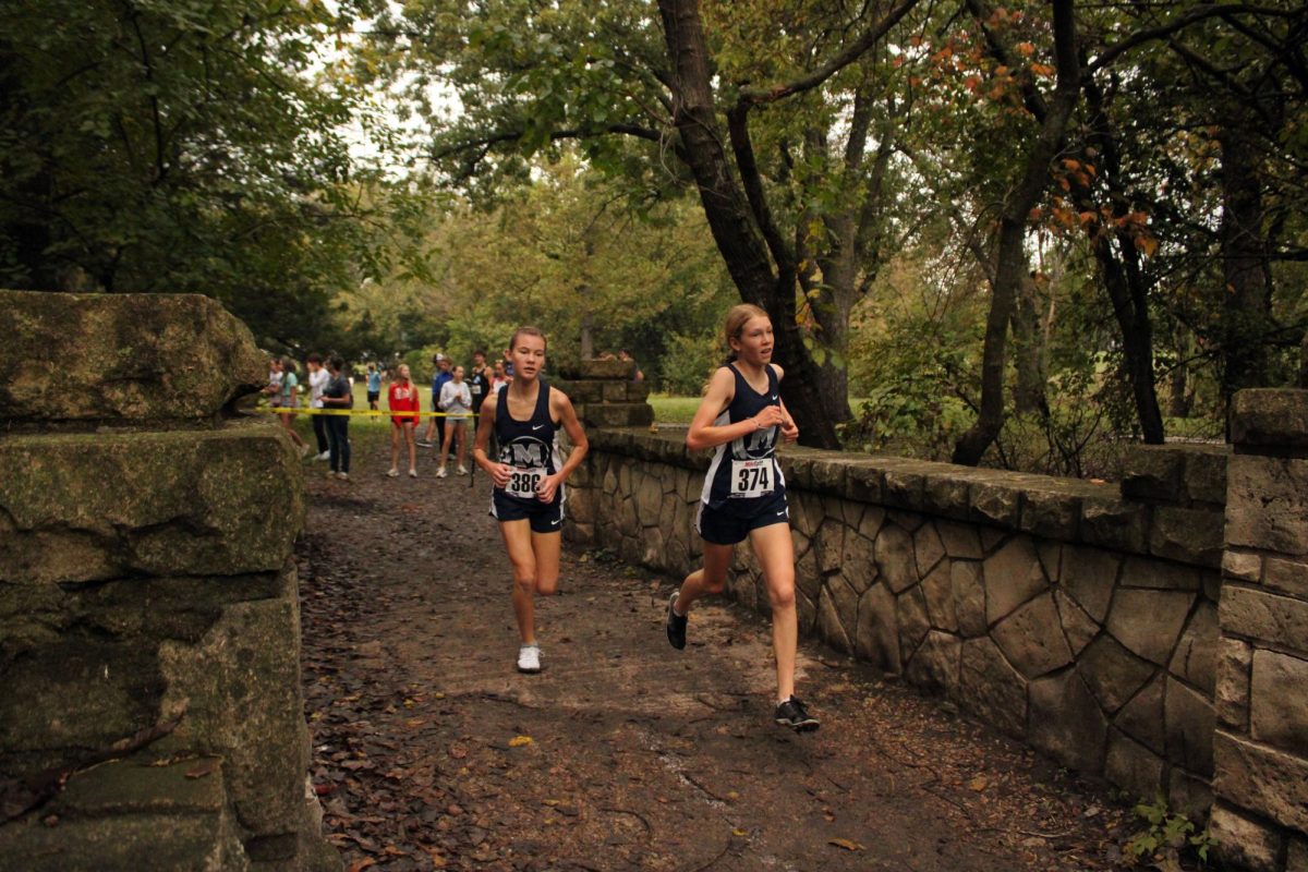 Partners. Freshmen Isla Spreer and Zara Koehn sprints across the brige with the other one right beside herself. Zara and Isla got 2nd and 3rd respectfully, helping Manhattan to sweep leage.