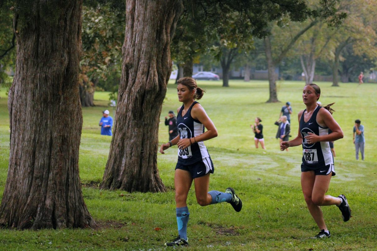 Go Manhattan! Scarlatt Williams and Andie Strathman running together. They both did well and lead Manhattan get 1st Place. 