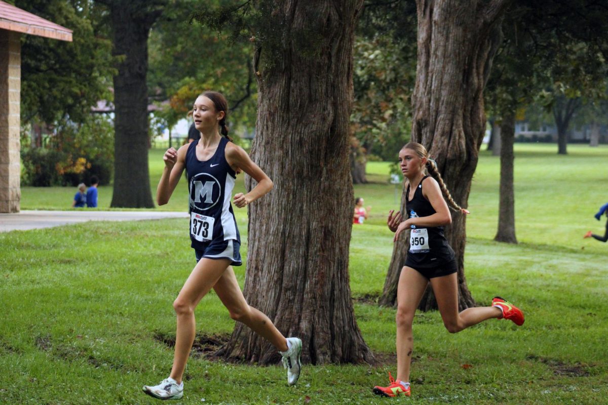 Go Manhattan! Allison Knopp sprints forward infront of a Woshbern runner. Allie did well and helped Manhattan get 1st Place at league. 