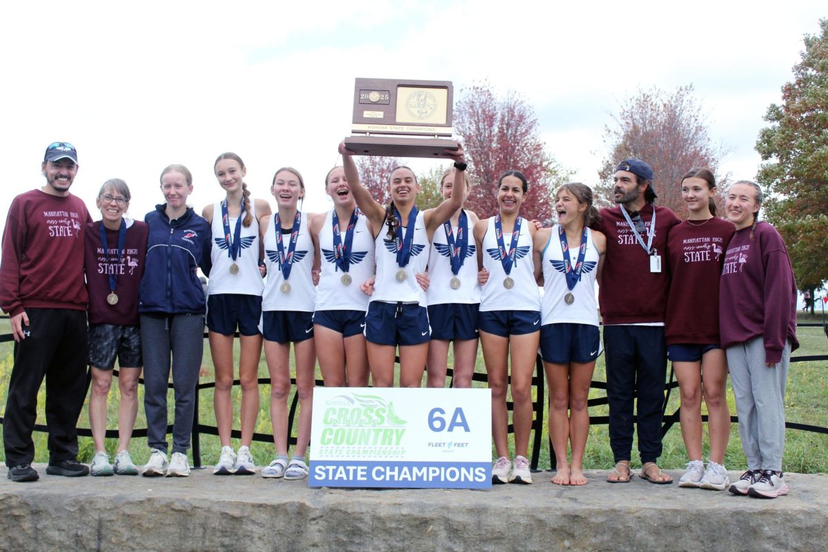 State Champs! Gabrielle Converse holding the girls state Champions trophy with all the Varsity Girls around her. Gabrielle placed 3rd at state leading Manhattan to win state for the first time sence 2015 and have a undefeated session. 